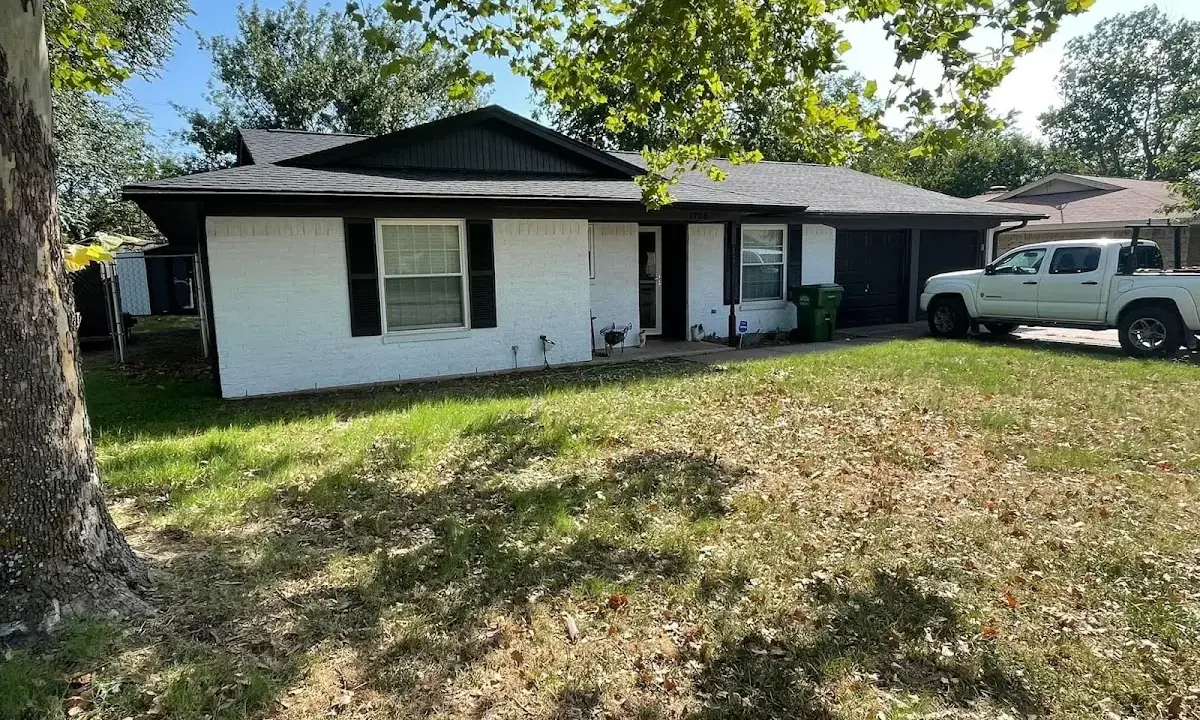 Professional roofing crew working on a residential roof in North Little Rock